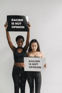 Angry Women Holding Placard while Seriously Looking at the Camera