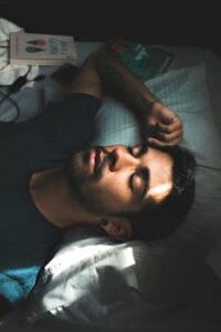 Man In Crew Neck T-shirt Lying On Bed